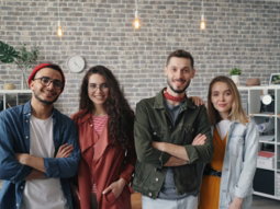 a group of people standing next to each other